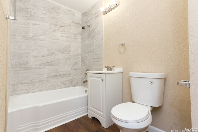 full bathroom featuring hardwood / wood-style floors, vanity,  shower combination, and toilet