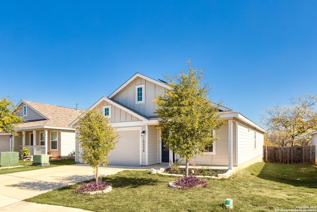 view of front of home featuring solar panels, central AC, a front lawn, and a garage