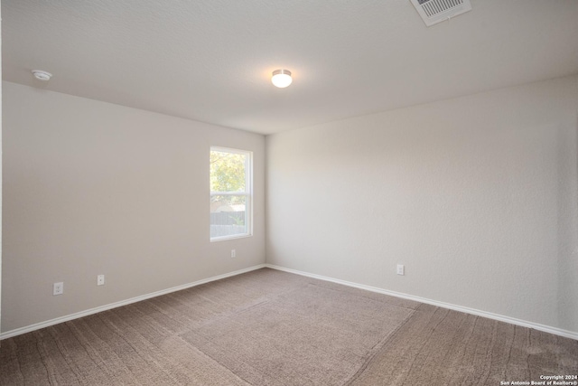 unfurnished room featuring carpet flooring