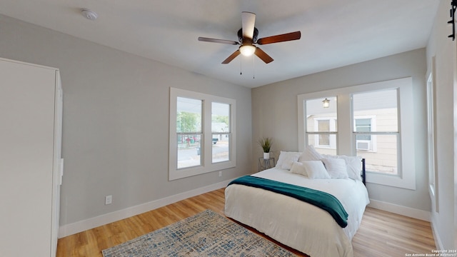 bedroom featuring ceiling fan and light hardwood / wood-style floors