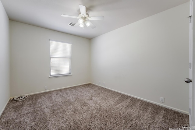 spare room with carpet flooring and ceiling fan