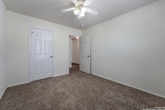 unfurnished bedroom featuring carpet and ceiling fan