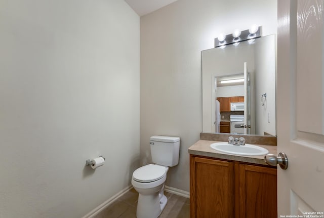 bathroom featuring decorative backsplash, vanity, and toilet