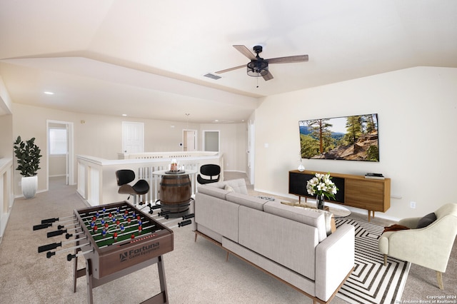 living room featuring light colored carpet, ceiling fan, and lofted ceiling