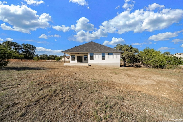 rear view of house featuring a patio