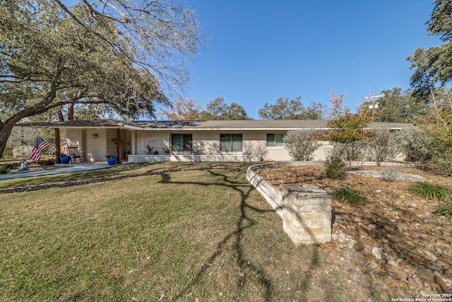 rear view of property with a lawn