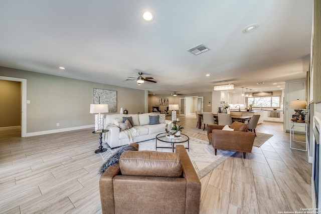 living room featuring ceiling fan