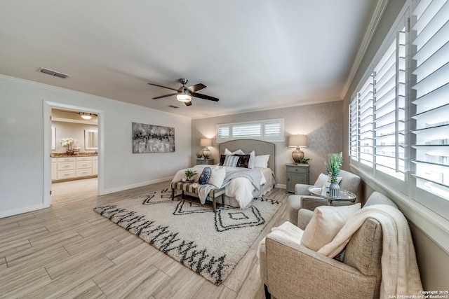 bedroom with ensuite bath, ceiling fan, and crown molding