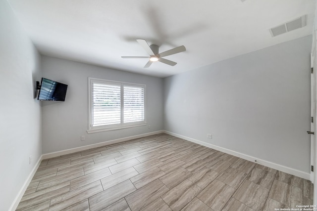 unfurnished room with ceiling fan