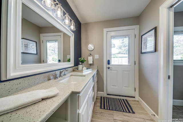 interior space with vanity and plenty of natural light