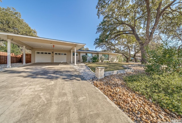 single story home with a carport and a garage