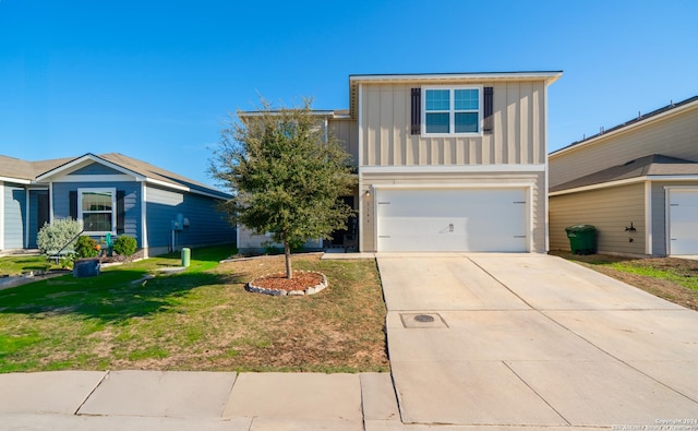 front facade with a garage and a front lawn