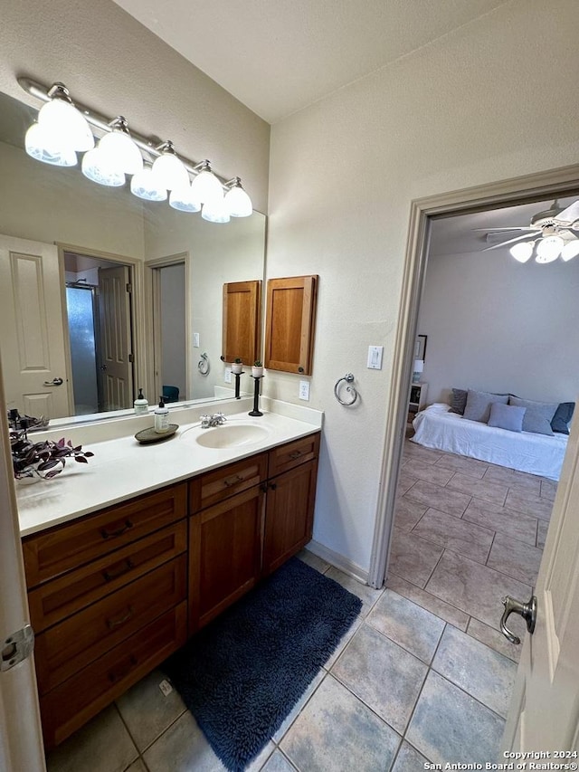 bathroom featuring vanity, tile patterned floors, and ceiling fan