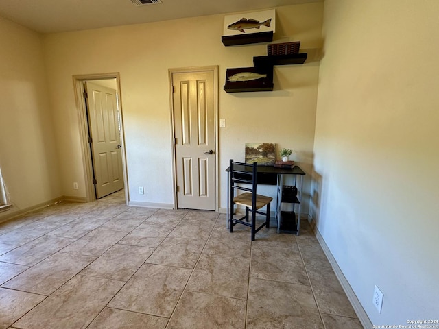 home office with light tile patterned flooring