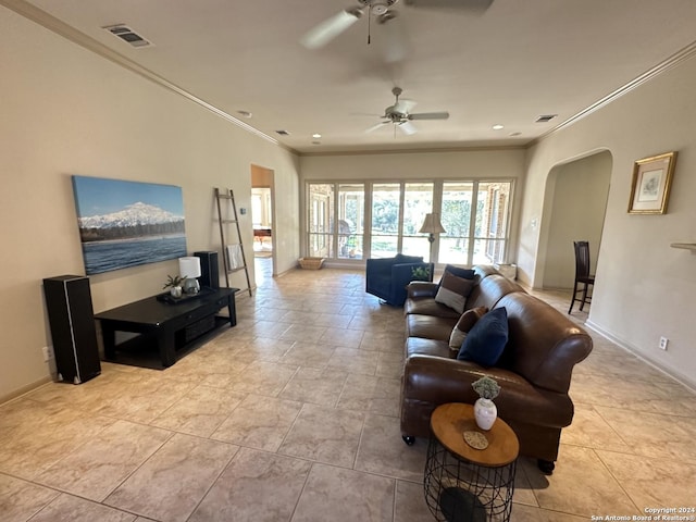 living room featuring ceiling fan and ornamental molding