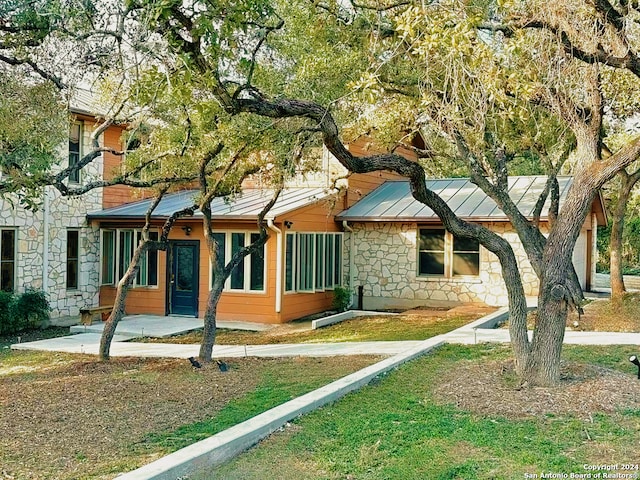 view of front of house with a patio