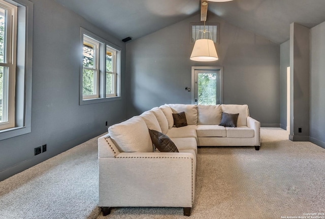 carpeted living room with plenty of natural light and vaulted ceiling