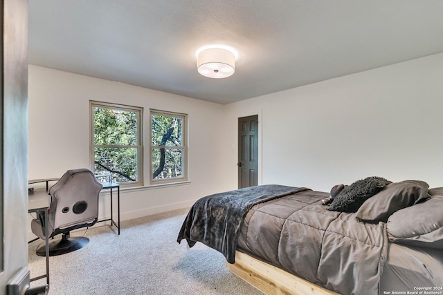 bedroom featuring light carpet