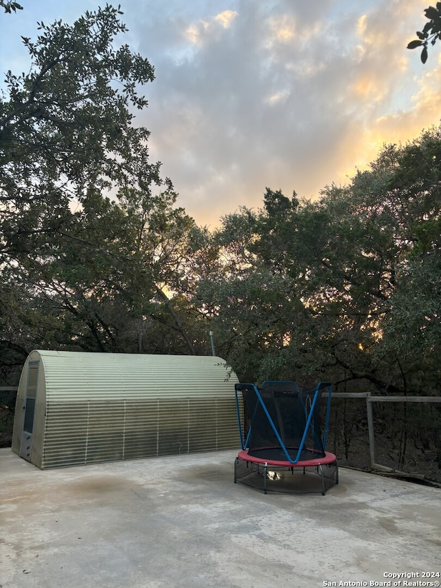 view of patio terrace at dusk