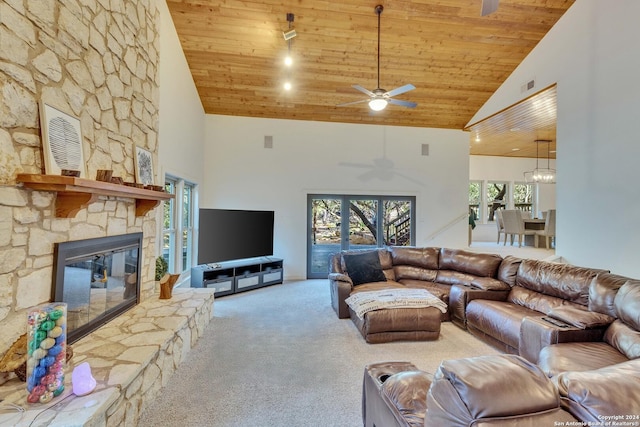 living room with a fireplace, wooden ceiling, light carpet, and high vaulted ceiling