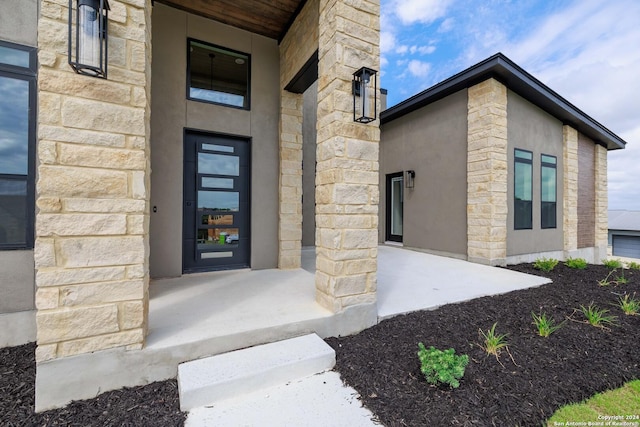 doorway to property with a porch