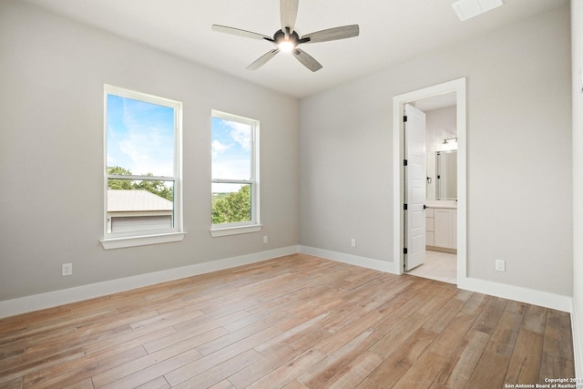 unfurnished bedroom with ceiling fan, light hardwood / wood-style flooring, and ensuite bath