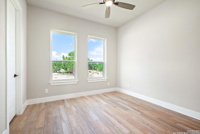 spare room featuring ceiling fan and light hardwood / wood-style flooring