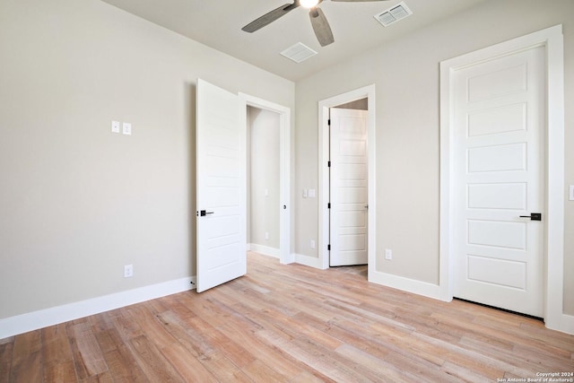 unfurnished bedroom with ceiling fan and light hardwood / wood-style floors