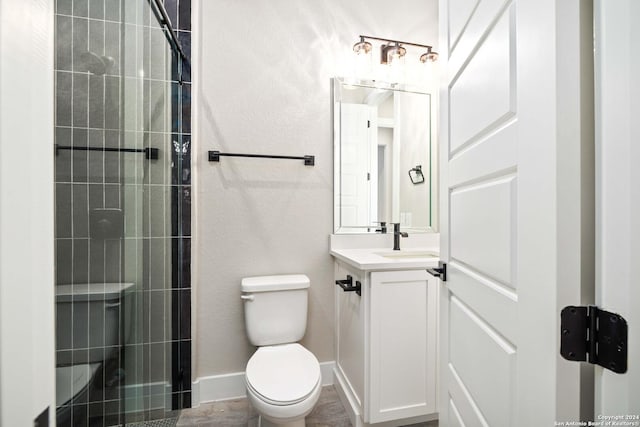 bathroom with vanity, toilet, and walk in shower