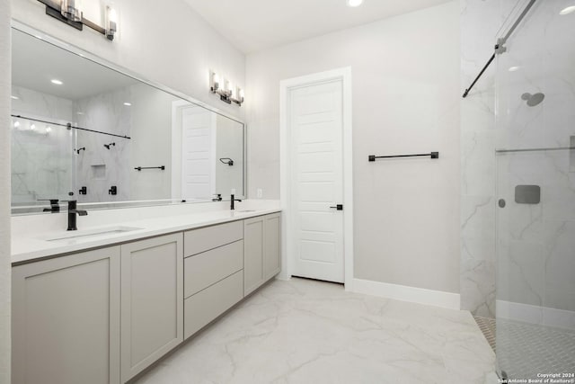 bathroom featuring a shower with door and vanity