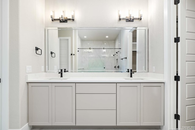 bathroom featuring vanity and a shower with door