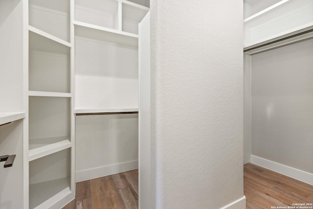 walk in closet featuring wood-type flooring