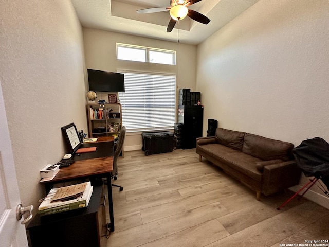 office space featuring ceiling fan and light wood-type flooring