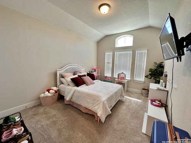 carpeted bedroom featuring a textured ceiling and lofted ceiling