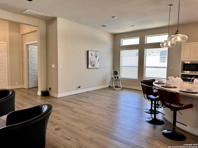 dining space with light wood-type flooring