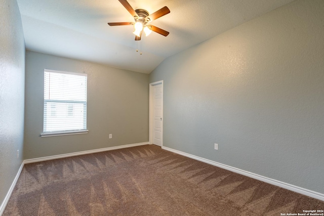 spare room with ceiling fan, carpet, and lofted ceiling