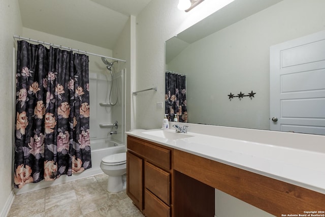 full bathroom featuring shower / bath combo, vanity, and toilet