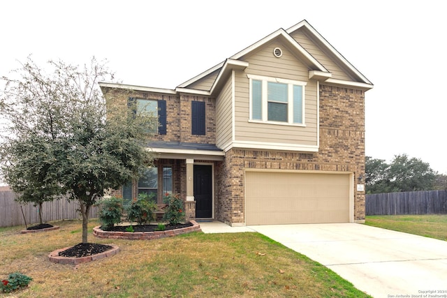 craftsman house featuring a front yard and a garage