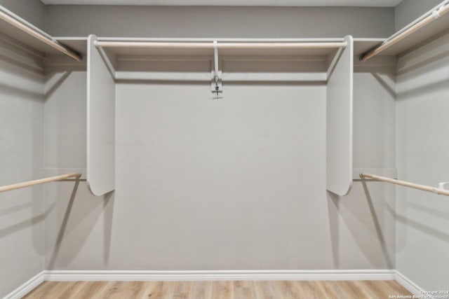 walk in closet featuring wood-type flooring