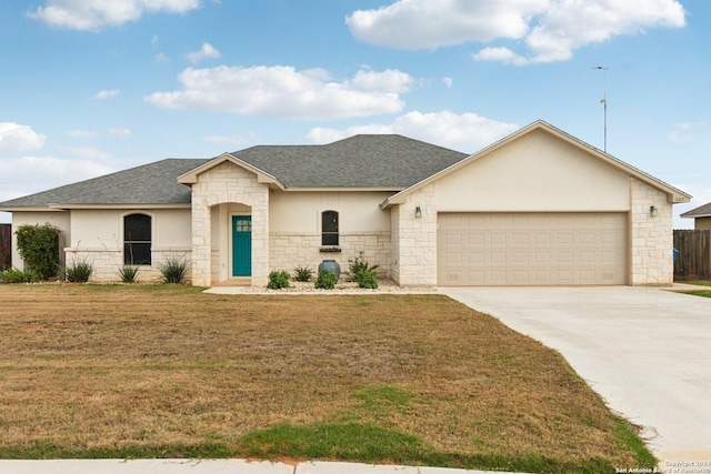 view of front facade featuring a front yard and a garage