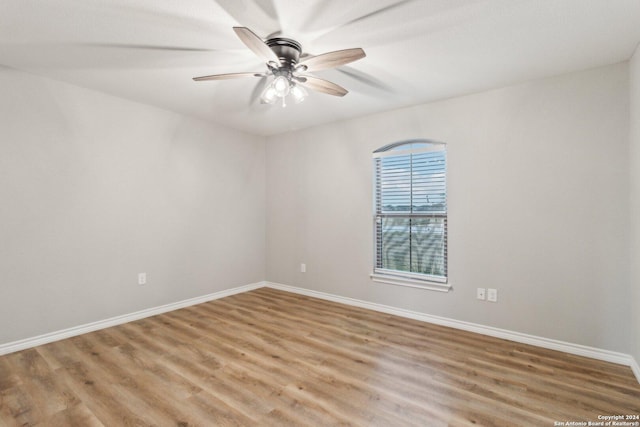 unfurnished room featuring hardwood / wood-style floors and ceiling fan