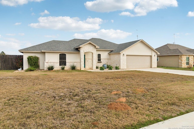 view of front of house with a front lawn and a garage