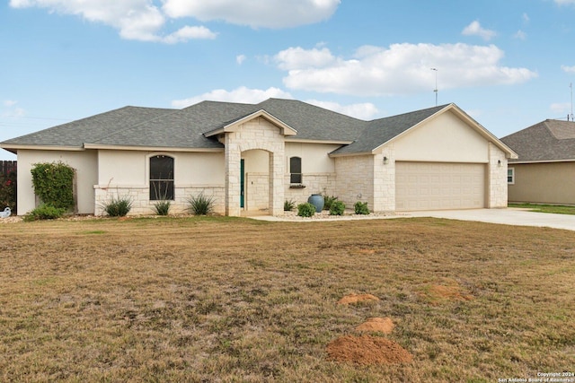 view of front facade with a garage and a front yard