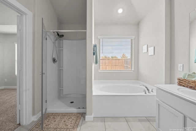 bathroom with separate shower and tub, tile patterned floors, and vanity