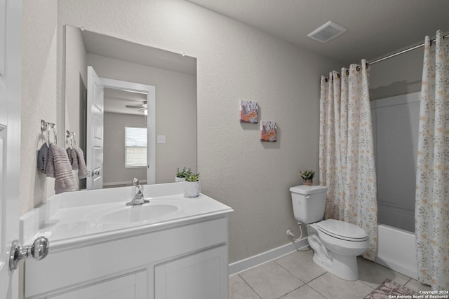 full bathroom with toilet, vanity, tile patterned floors, and shower / bath combo with shower curtain