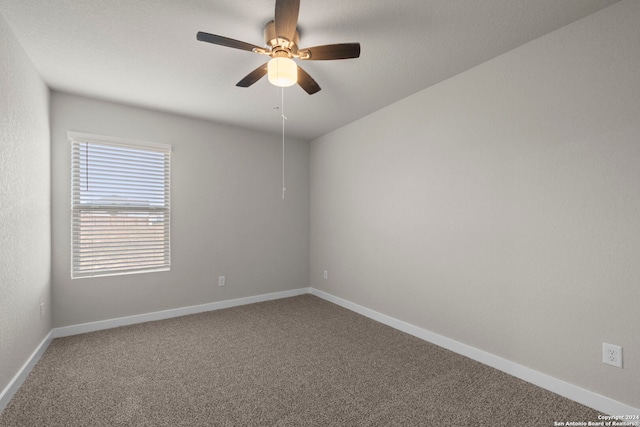 spare room with carpet flooring and ceiling fan