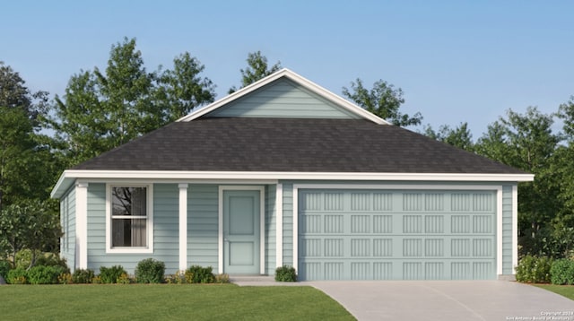 view of front of home featuring a front yard and a garage