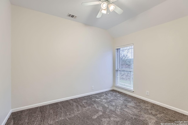 carpeted empty room with ceiling fan and lofted ceiling