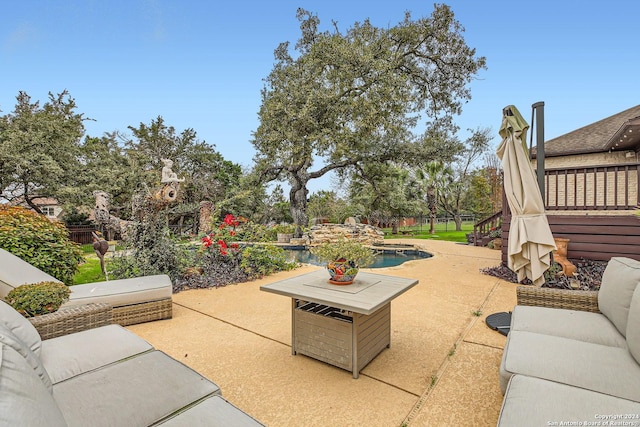 view of patio / terrace with a fenced in pool