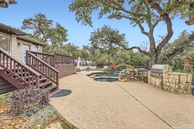 exterior space with outdoor lounge area, area for grilling, and a deck